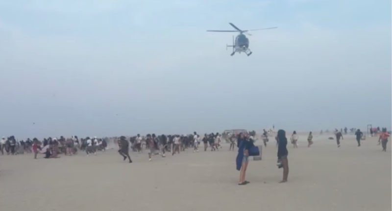 Hundreds of teenagers transform peaceful beach into chaos as police forced to break up fights