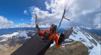 A paraglider in the French Alps during a storm.