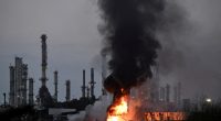 Large fire and smoke at an industrial facility.
