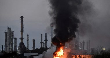 Large fire and smoke at an industrial facility.