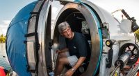 Stockton Rush, CEO of OceanGate, sitting inside a submersible.