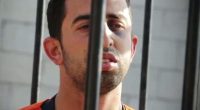 Lieutenant Muath al-Kasaesbeh, a Jordanian pilot, behind bars.
