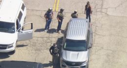 ICE agents descend on Dodger Stadium two weeks after LA riots