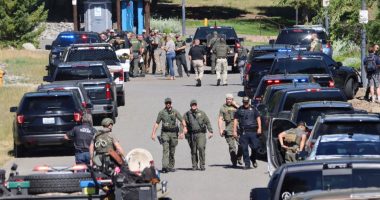 Law enforcement and emergency responders at a park following reports of a shooting.
