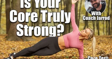 Fit woman in pink top and black leggings holding side plank pose on yoga mat during an outdoor workout in forest surrounded by autumn leaves. If You Can Hold These 3 Planks, Your Core Strength Is Elite. Cover