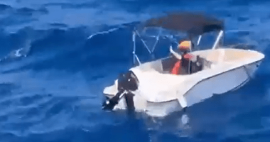 Small motorboat on the ocean.