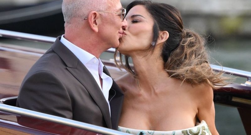 Jeff Bezos and Lauren Sanchez kissing on a boat.