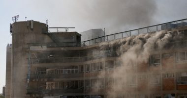 Smoke billows from Soroka Medical Center after a missile strike.