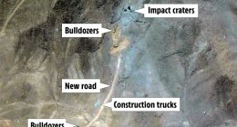 Aerial view of construction activity showing bulldozers, construction trucks, a new road, and impact craters.