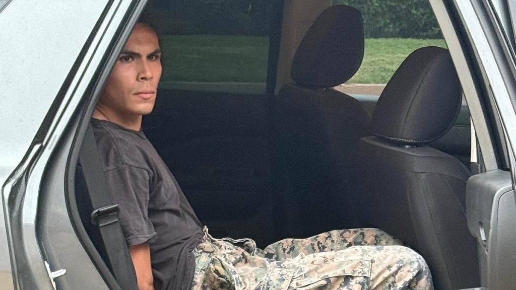 LA menace seen handing out war-time masks to protesters identified