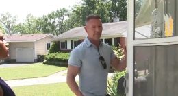 Homeowner stands outside his home, which was recently occupied by squatters.