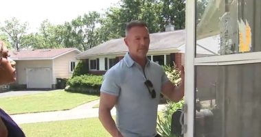 Homeowner stands outside his home, which was recently occupied by squatters.