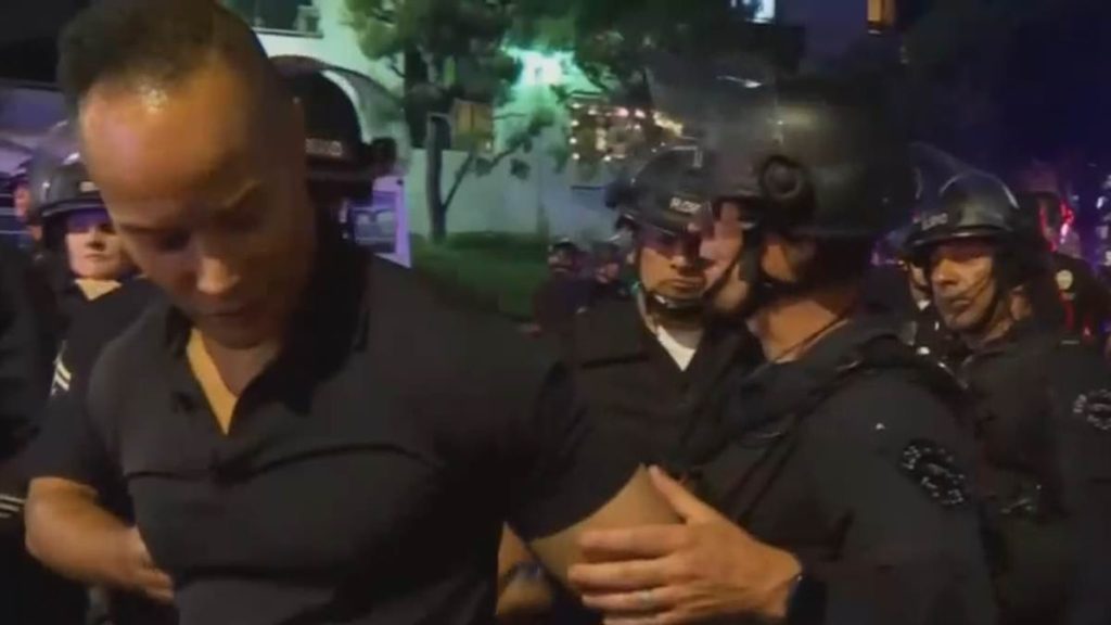 Moment CNN host realizes reporter is being detained by LAPD