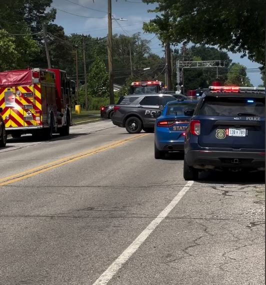 Emergency vehicles at the scene of an active shooter incident outside a church.