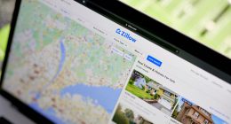 Laptop displaying Zillow real estate listings.