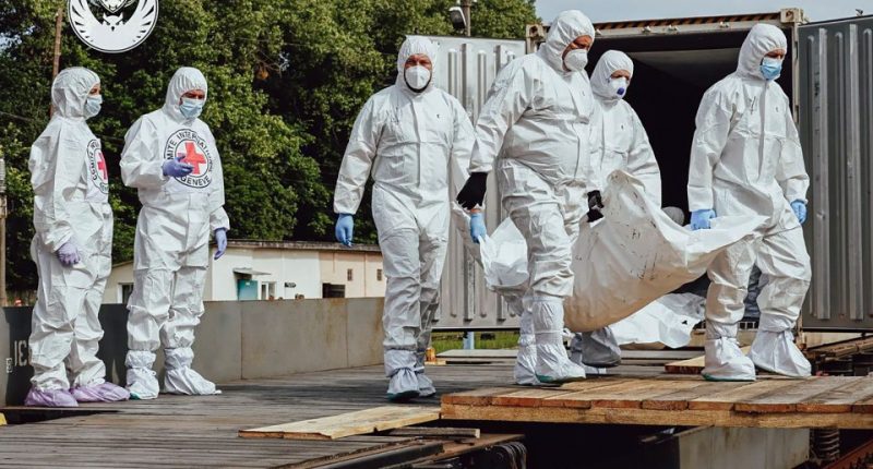 Ukrainian special team members repatriating the bodies of fallen soldiers.