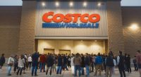 Long line of people waiting to enter a Costco Wholesale store.