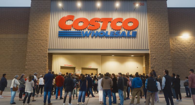 Long line of people waiting to enter a Costco Wholesale store.