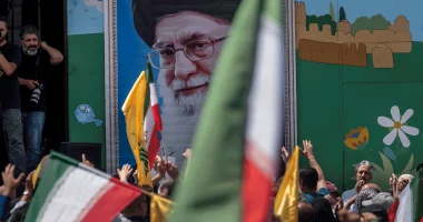 Supreme Leader Ayatollah Ali Khamenei image on the wall during a pro-Iran demonstration