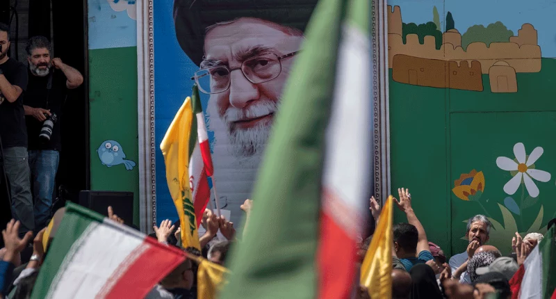 Supreme Leader Ayatollah Ali Khamenei image on the wall during a pro-Iran demonstration