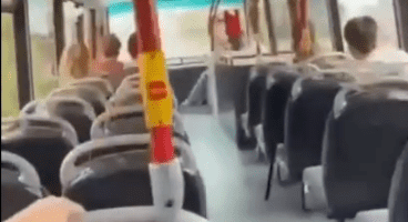 Screenshot of the inside of a bus filled with smoke.