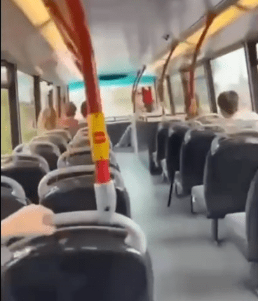Screenshot of the inside of a bus filled with smoke.