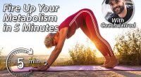 Old Woman in yoge pose Downward Facing Dog in the sunrise