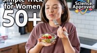 A young pretty cheerful woman is eating a salad. Healthy eating