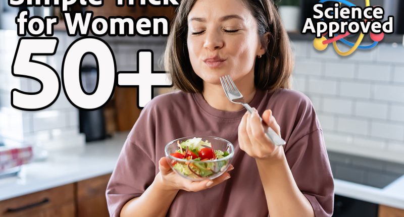 A young pretty cheerful woman is eating a salad. Healthy eating