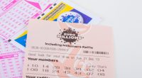 EuroMillions lottery ticket with numbers and raffle code.
