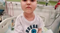 Photo of 7-year-old Anastasia Borik in a hospital bed.