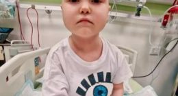 Photo of 7-year-old Anastasia Borik in a hospital bed.