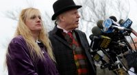 Mari Gilbert and her lawyer speaking at a news conference.