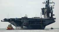 USS Nimitz carrier strike group sailing toward Middle East ahead of schedule, US official says