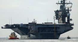USS Nimitz carrier strike group sailing toward Middle East ahead of schedule, US official says