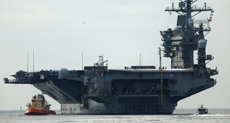 USS Nimitz carrier strike group sailing toward Middle East ahead of schedule, US official says