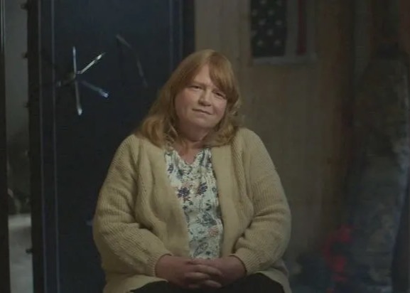 Asa Ellerup sitting in front of a safe.