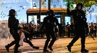 'Savage' PSG fans tear Paris apart following historic first Champions League with French riot police forced to tear gas supporters and make 131 arrest while the city of light BURNS