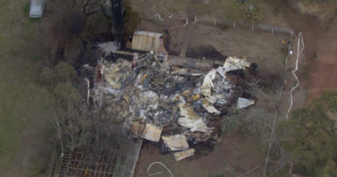 An investigation is underway after a man was assaulted by armed intruders before he was thrown into a car, and his house was set on fire in Yea, Victoria.