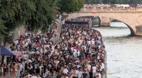 PARIS, FRANCE - JUNE 21: Thousands of people gather at the Chatelet district and on the banks of the Seine to celebrate Fete De La Musique 2025 as bands and DJ's play across Paris, France on June 21, 2025. (Photo by Luc Auffret/Anadolu via Getty Images)