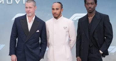 Brad Pitt, Lewis Hamilton and Damson Idris pose for photos on the red carpet