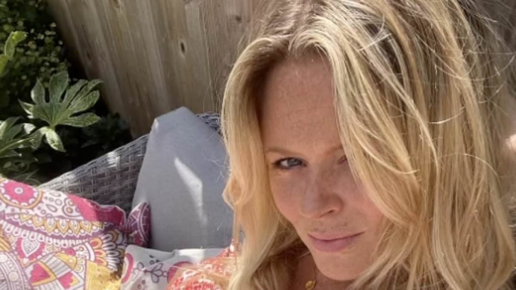 Emily Atack stuns in a bandeau swimsuit and tops up her tan