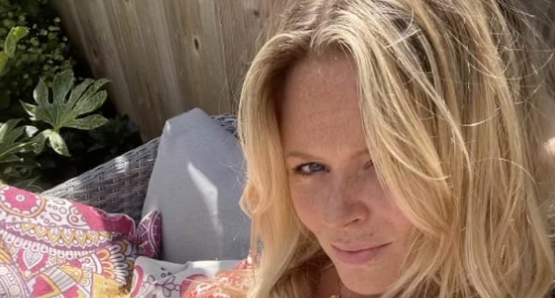 Emily Atack stuns in a bandeau swimsuit and tops up her tan