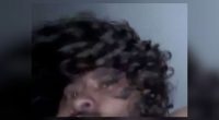 Blurry image of a man with curly hair