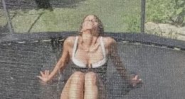 Halle Berry, 58, bounces on trampoline in just a cheeky swimsuit as she’s sprayed with a hose