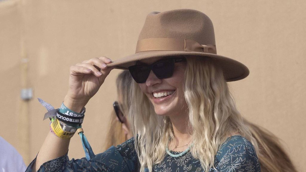 Holly Willoughby makes a rare appearance with husband Dan Baldwin as she opts for a chic paisley dress for the final day of sun-soaked Glastonbury