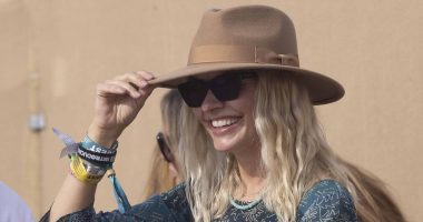 Holly Willoughby makes a rare appearance with husband Dan Baldwin as she opts for a chic paisley dress for the final day of sun-soaked Glastonbury