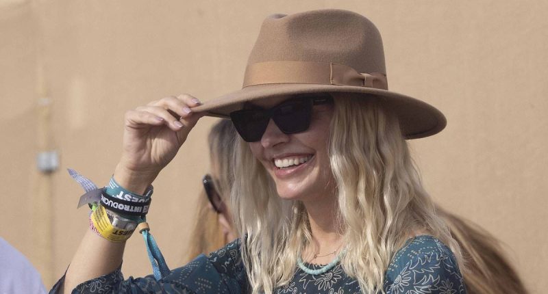 Holly Willoughby makes a rare appearance with husband Dan Baldwin as she opts for a chic paisley dress for the final day of sun-soaked Glastonbury