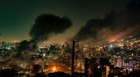 Smoke rises from buildings
