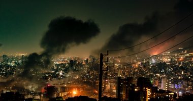 Smoke rises from buildings